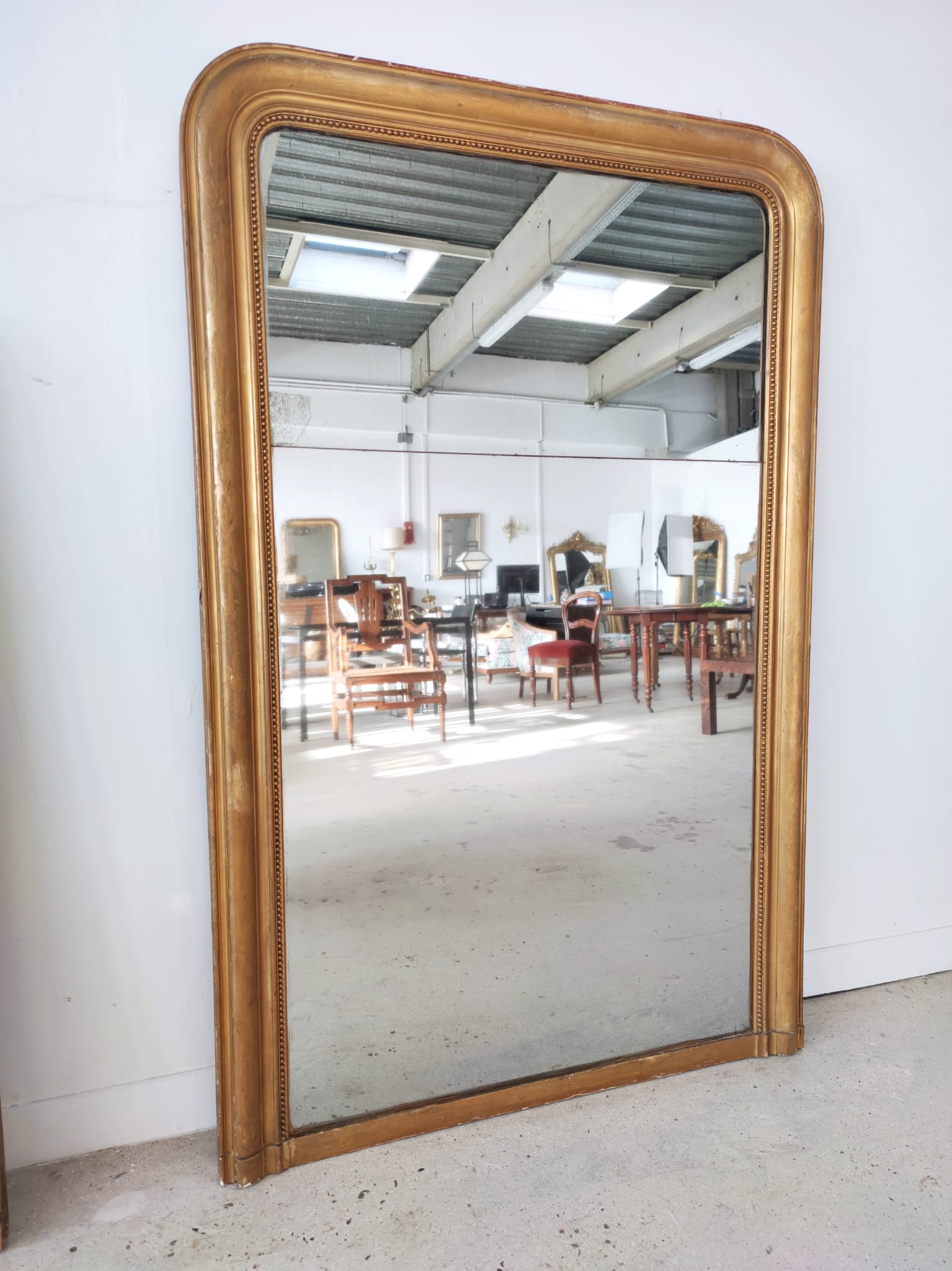 Ancien miroir de cheminée de style Louis Philippe double glace au mercure cadre redoré XIXème H: 1m48